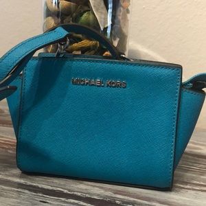 Micheal Kors turquoise cross body bag